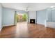 Spacious living room with fireplace, wood floors, and sliding glass doors to a patio at 111 Riverstone Commons Cir, Canton, GA 30114