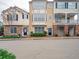 Street view of well-maintained townhomes showcasing varied architectural styles and manicured landscaping at 111 Riverstone Commons Cir, Canton, GA 30114