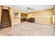Finished basement featuring tile flooring, a ceiling fan, and an open layout for versatile use at 1460 Edgemont Pt, Lawrenceville, GA 30044