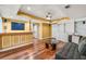 Finished basement with hardwood floors, wet bar, recessed lighting, and built-in shelving at 1460 Edgemont Pt, Lawrenceville, GA 30044