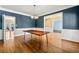 Open dining room with stylish table and open view into other areas at 1460 Edgemont Pt, Lawrenceville, GA 30044