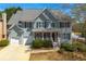 Charming two-story home featuring a well-manicured lawn and a two-car garage at 1460 Edgemont Pt, Lawrenceville, GA 30044