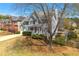 Two-story home with a covered front porch and nice landscaping in a suburban neighborhood at 1460 Edgemont Pt, Lawrenceville, GA 30044