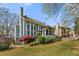 Exterior home view featuring a screened in porch and patio at 1460 Edgemont Pt, Lawrenceville, GA 30044