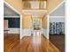 Bright foyer with hardwood floors, wainscoting, and views of the formal living area at 1460 Edgemont Pt, Lawrenceville, GA 30044