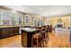 Spacious kitchen with an island, stainless steel appliances, and views into dining and living areas at 1460 Edgemont Pt, Lawrenceville, GA 30044
