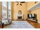 Spacious living room with tall windows, fireplace, and neutral tones at 1460 Edgemont Pt, Lawrenceville, GA 30044