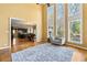 Bright living room boasts soaring ceilings, large windows, and an adjacent kitchen for easy entertaining at 1460 Edgemont Pt, Lawrenceville, GA 30044