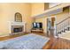 Large living room with vaulted ceiling, fireplace, and hardwood floors at 1460 Edgemont Pt, Lawrenceville, GA 30044