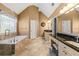 An expansive main bathroom with double sinks, a soaking tub and a glass enclosed shower at 1460 Edgemont Pt, Lawrenceville, GA 30044