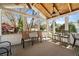 Relaxing screened-in patio with comfortable seating and ceiling fans at 1460 Edgemont Pt, Lawrenceville, GA 30044