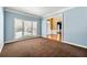 Flex room with natural light, neutral paint, and view of the front yard at 1460 Edgemont Pt, Lawrenceville, GA 30044