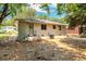 Rear view of a bright, one-story home with a fenced backyard, offering privacy and security at 732 Quaker Sw St, Atlanta, GA 30315