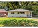 Charming, one story home with a well-maintained lawn and a driveway leading to the house at 732 Quaker Sw St, Atlanta, GA 30315
