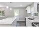 Modern kitchen with marble countertops, stainless appliances, and ample natural light at 732 Quaker Sw St, Atlanta, GA 30315