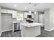 Bright and modern kitchen featuring a central island with seating, stainless steel appliances, and plenty of cabinet space at 732 Quaker Sw St, Atlanta, GA 30315