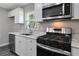 Modern kitchen with stainless steel appliances and granite countertops at 732 Quaker Sw St, Atlanta, GA 30315