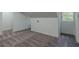 Finished attic space with gray carpet, white walls, trim and a window at 1956 Washington Rd, East Point, GA 30344