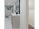 Contemporary bathroom featuring gray vanity, black hardware, and a sleek walk-in shower at 1956 Washington Rd, East Point, GA 30344
