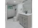 Renovated bathroom featuring gray vanity, black hardware, and a walk-in shower at 1956 Washington Rd, East Point, GA 30344