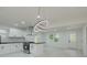 Newly renovated kitchen featuring an island cooktop and modern light fixtures at 1956 Washington Rd, East Point, GA 30344
