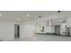 Newly renovated kitchen featuring an island cooktop and modern light fixtures at 1956 Washington Rd, East Point, GA 30344