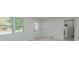 Bright living room area with new laminate floors and lots of windows at 1956 Washington Rd, East Point, GA 30344