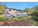 Backside of house with some grass and trees at 3650 Clovis Nw Ct, Atlanta, GA 30331