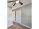 Bedroom showing wood floors, a ceiling fan and access to closet at 3650 Clovis Nw Ct, Atlanta, GA 30331