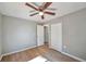Bedroom featuring wood floors, closet access and a ceiling fan at 3650 Clovis Nw Ct, Atlanta, GA 30331
