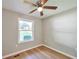 Bedroom with hardwood floors, a ceiling fan, and a window at 3650 Clovis Nw Ct, Atlanta, GA 30331