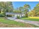 Charming single-story home with a well-manicured lawn, covered carport, and inviting curb appeal at 3650 Clovis Nw Ct, Atlanta, GA 30331