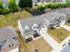 Aerial view of a new construction home with a well-manicured lawn at 3681 Deaton Trl, Buford, GA 30519
