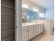 Primary bathroom with double vanity, soaking tub, and walk-in closet at 3681 Deaton Trl, Buford, GA 30519