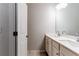 Bright bathroom features a double vanity with white countertops and modern fixtures at 3681 Deaton Trl, Buford, GA 30519