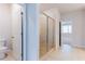 Modern bathroom features a walk-in shower with glass door, tile flooring, and neutral decor at 3681 Deaton Trl, Buford, GA 30519
