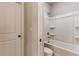 This bathroom features a tub/shower combo with a white toilet at 3681 Deaton Trl, Buford, GA 30519