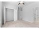 Bedroom features a closet and a ceiling fan at 3681 Deaton Trl, Buford, GA 30519