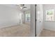Neutral bedroom with carpet, ceiling fan and natural light from the windows at 3681 Deaton Trl, Buford, GA 30519