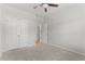 Light-filled bedroom features plush carpeting and a double door closet at 3681 Deaton Trl, Buford, GA 30519