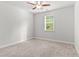 Spacious bedroom with carpet, large window and plenty of natural light at 3681 Deaton Trl, Buford, GA 30519