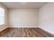 Neutral bedroom with hard surface floors and natural light at 3681 Deaton Trl, Buford, GA 30519