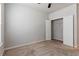 This bedroom features neutral carpet, a ceiling fan, and closet for storage at 3681 Deaton Trl, Buford, GA 30519