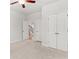 Carpeted bedroom with ceiling fan, double door closet, and view to staircase at 3681 Deaton Trl, Buford, GA 30519