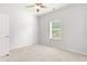 Bedroom features a window, a ceiling fan, and carpet at 3681 Deaton Trl, Buford, GA 30519