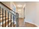 Elegant foyer with wood stairs, iron balusters, and modern finishes at 3681 Deaton Trl, Buford, GA 30519