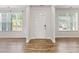 Welcoming foyer with hardwood floors, bright windows, and classic trim work, creating a charming entryway at 3681 Deaton Trl, Buford, GA 30519