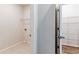 This laundry room has tile floors, washer/dryer hookups, and metal shelving at 3681 Deaton Trl, Buford, GA 30519