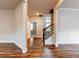 Open living room area features hardwood floors, neutral walls, and a stairway at 3681 Deaton Trl, Buford, GA 30519