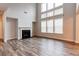 Light-filled living space with a fireplace and views of the second-floor loft at 3681 Deaton Trl, Buford, GA 30519
